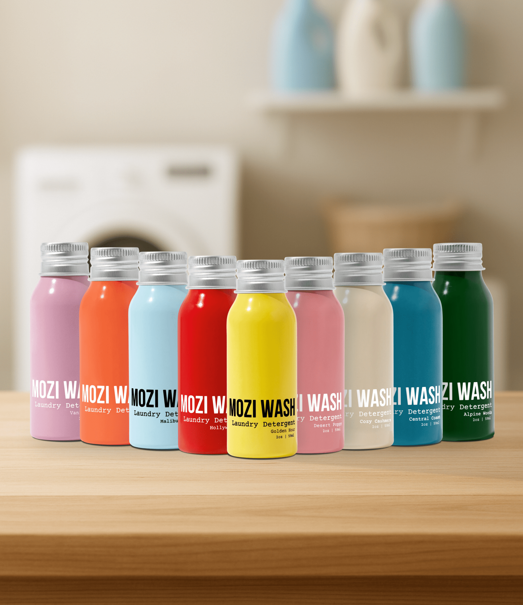 Row of colorful bottles labeled 'Wazozi Wash' on a wooden surface with a kitchen background.