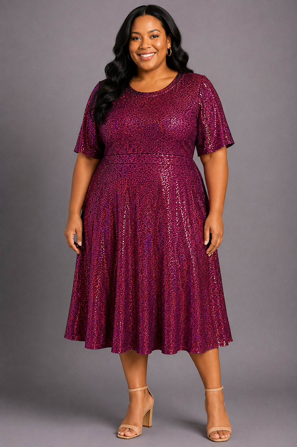 A woman modeling a short-sleeve, knee-length A-line dress covered in shimmering metallic sequins. The dress is a deep magenta-purple color with a sparkling texture, paired with nude high-heeled sandals, set against a solid gray studio background.