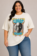 A woman modeling a cream-colored t-shirt with a retro-style graphic of a panther and the text 'CABOT Panthers' in blue, orange, and yellow. She is wearing blue jeans against a solid light gray studio background.