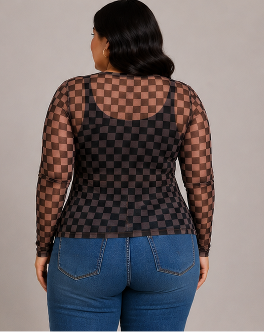 A woman shown from the back wearing a sheer black and dark brown checkerboard long-sleeve top with blue jeans, against a plain light gray studio background.