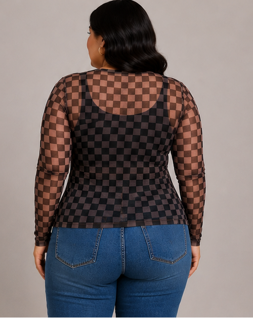 A woman shown from the back wearing a sheer black and dark brown checkerboard long-sleeve top with blue jeans, against a plain light gray studio background.