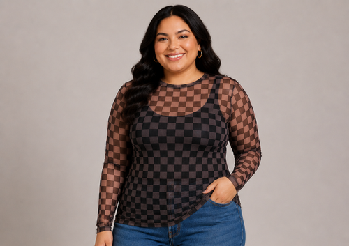 A woman modeling a sheer long-sleeve top with a brown and black checkerboard pattern over a black tank top, paired with blue jeans, against a solid gray studio background.